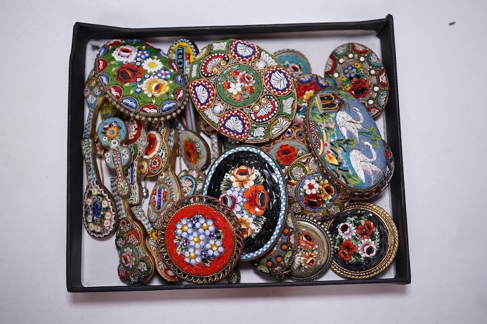 Thirty-one costume micro-mosaic brooches, to include seventeen guitar and banjo shaped brooches, five large oval/ circular brooches including scenic swan brooch, eight, smaller brooches and a pendant. Condition - fair/go